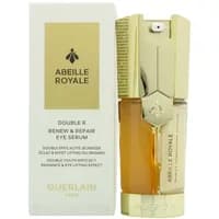 Gold and amber Guerlain Double R Eye Serum bottle with bee emblem, next to white box with gold text.