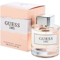 Clear glass bottle with silver cap, Guess 1981 Eau de Toilette, next to pink box with white label.