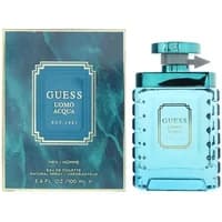 Turquoise Guess Uomo Acqua Eau De Toilette bottle with matching box, featuring gold and blue accents.
