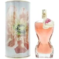 Jean Paul Gaultier La Belle Flower Edition perfume, torso-shaped pink bottle with floral accent, next to floral tin.
