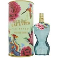 Jean Paul Gaultier La Belle Paradise Garden perfume, blue torso-shaped bottle with floral accents, gold cap, floral box.