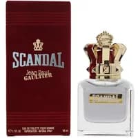 Clear glass bottle with gold crown cap, red box labeled "Scandal Jean Paul Gaultier" for men's eau de toilette 50ml.