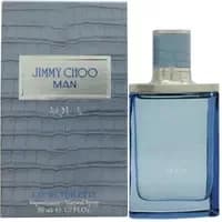 Jimmy Choo Man Aqua Eau De Toilette 50ml, blue glass bottle with silver cap, next to textured blue box.