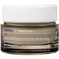 Korres Black Pine moisturizer in a clear jar with white lid, featuring bold black and white text on the label.