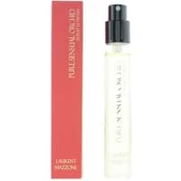 Clear glass spray bottle of Laurent Mazzone Pure Sensual Orchid Extrait De Parfum, red box with white text.