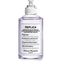 Clear glass bottle of Maison Margiela women's marine perfume with silver spray nozzle and white label.