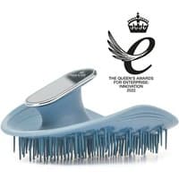 Blue Manta Mirror Healthy Hair & Scalp Brush with flexible bristles and ergonomic handle, award emblem displayed.