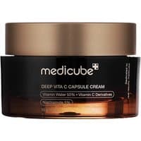 Medicube Deep Vita C Capsule Cream in a dark amber jar with a gold lid, featuring white and gold text.