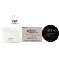Philosophy Ultimate Miracle Worker set with pearl serum bottle, black lid jar, and box with text.