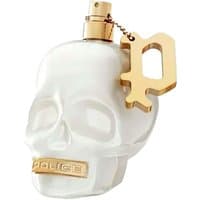 White skull-shaped bottle of Police To Be Born To Shine perfume with gold cap and letter "P" charm.