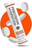 Orange tube of Precision Hydration electrolyte tablets, labeled 1000mg/L, with white effervescent tablets around it.