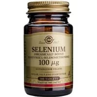 Brown glass bottle of Solgar Selenium 100µg, gold cap, beige label with black and red text, 100 tablets supplement.