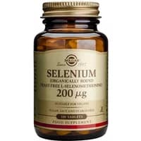 Brown glass bottle of Solgar Selenium 200µg, 50 tablets, with gold cap and beige label detailing supplement information.