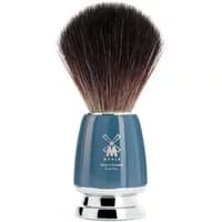 Mühle Rytmo shaving brush with synthetic bristles and glossy blue handle, featuring a silver base.