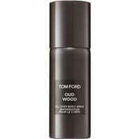 Tom Ford Oud Wood body spray in sleek dark brown cylindrical bottle with white text, 150 ml.