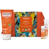 Weleda Arnica Sports Aftercare Gift Set with orange tube, small bottle, cream, and colorful patterned pouch.