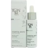 White Yon-ka Paris Essential White Solution bottle with silver cap and dropper, next to matching branded box.