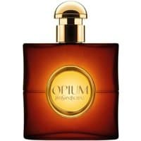 Amber YSL Opium Pour Femme Eau de Toilette bottle with gold cap and circular gold label.