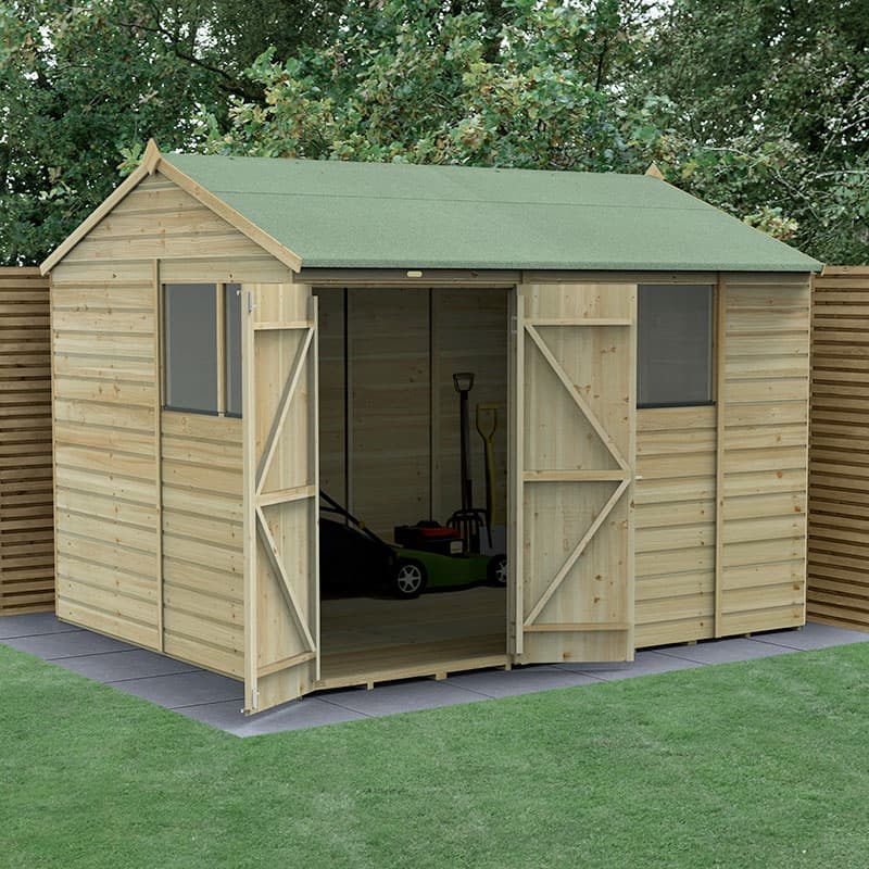 Wooden shed with a green apex roof, double doors open to reveal interior storage space, made from pressure-treated shiplap, featuring windows and surrounded by greenery.