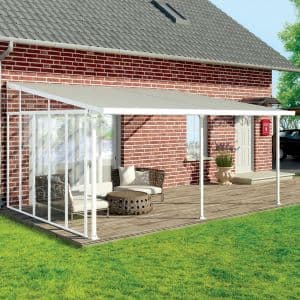 White 13' Palram Canopia Patio Cover Side Wall Series 4 with a sleek design, featuring clear panels, metal frame, and a modern aesthetic, enhancing outdoor space by a brick house.