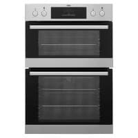 Stainless steel double oven with black glass doors, featuring a digital display and three control knobs for temperature and settings.