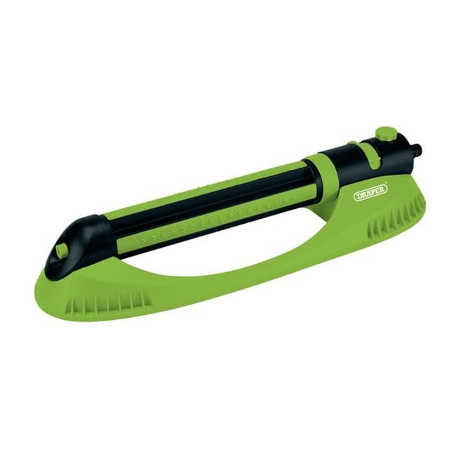 Green and black oscillating sprinkler with a long rectangular body, featuring adjustable jets for customizable watering, designed for efficient lawn irrigation.