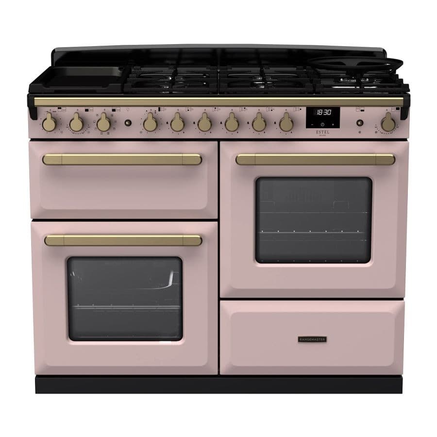 Dual fuel range cooker in pale pink with antique brass accents, featuring five gas burners, two large ovens with glass doors, and elegant control knobs.