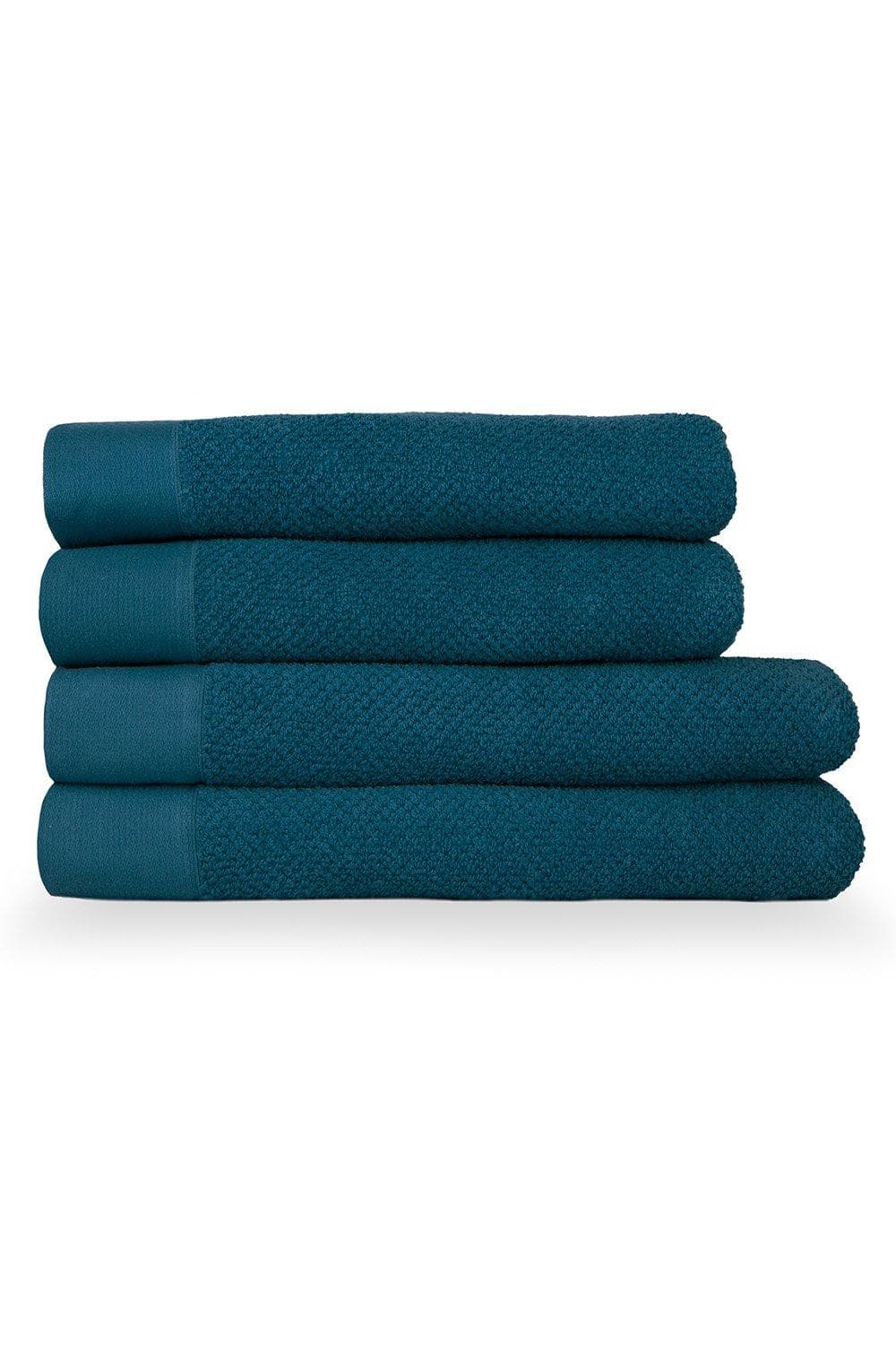 Four stacked bath towels in a rich teal color, featuring a textured weave and smooth cotton panels, showcasing a soft, plush appearance ideal for bathroom use.