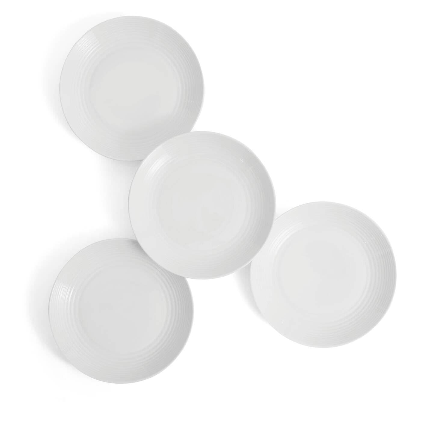 Set of four elegant white dinner plates by Royal Doulton, featuring a subtle ribbed design and smooth porcelain finish, perfect for any dining occasion.