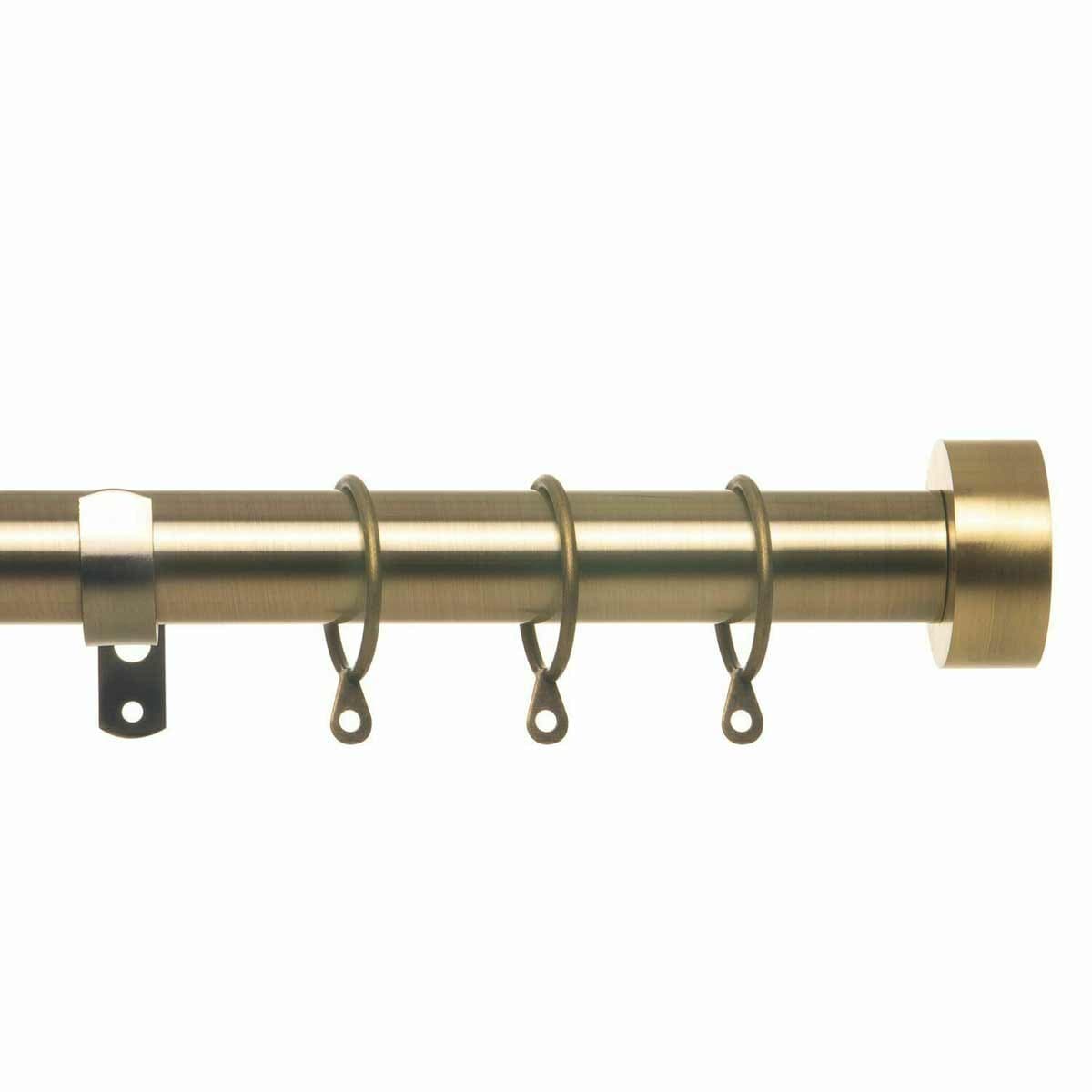 Extendable antique brass curtain pole set featuring a sleek design, adjustable from 40cm to 325cm, with several rings for easy curtain hanging.