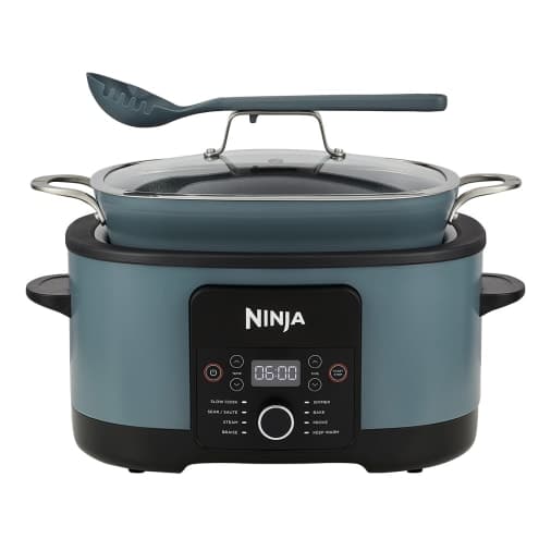 Ninja 42cm Multi Cooker in blue with a sleek design, featuring a digital control panel, a glass lid, and a spatula, ideal for versatile cooking.