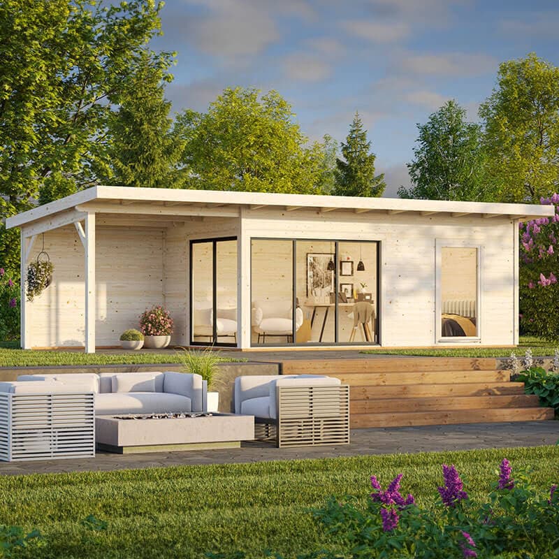 Contemporary log cabin with a light wood finish, double glazed sliding doors, and a gazebo-style roof, surrounded by greenery and outdoor seating.