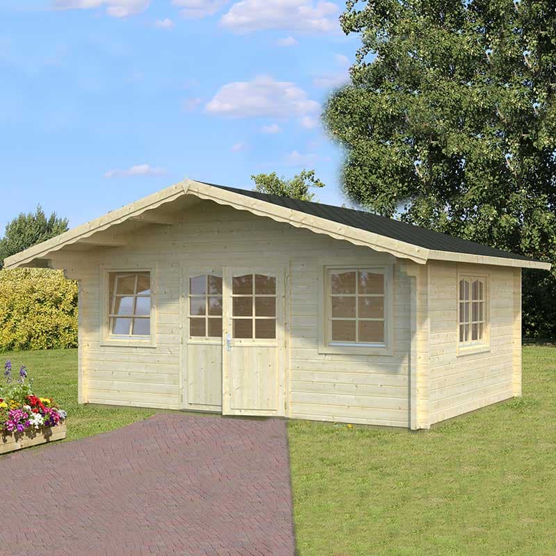 Light-colored wooden log cabin with a sloped roof, double doors, and multiple windows, set in a grassy area with flower beds and trees in the background.