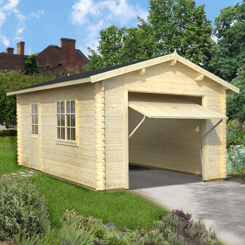 Light-colored wooden log cabin garage with a sloped roof, featuring an up-and-over door, two windows, and a natural setting with greenery and a clear blue sky.
