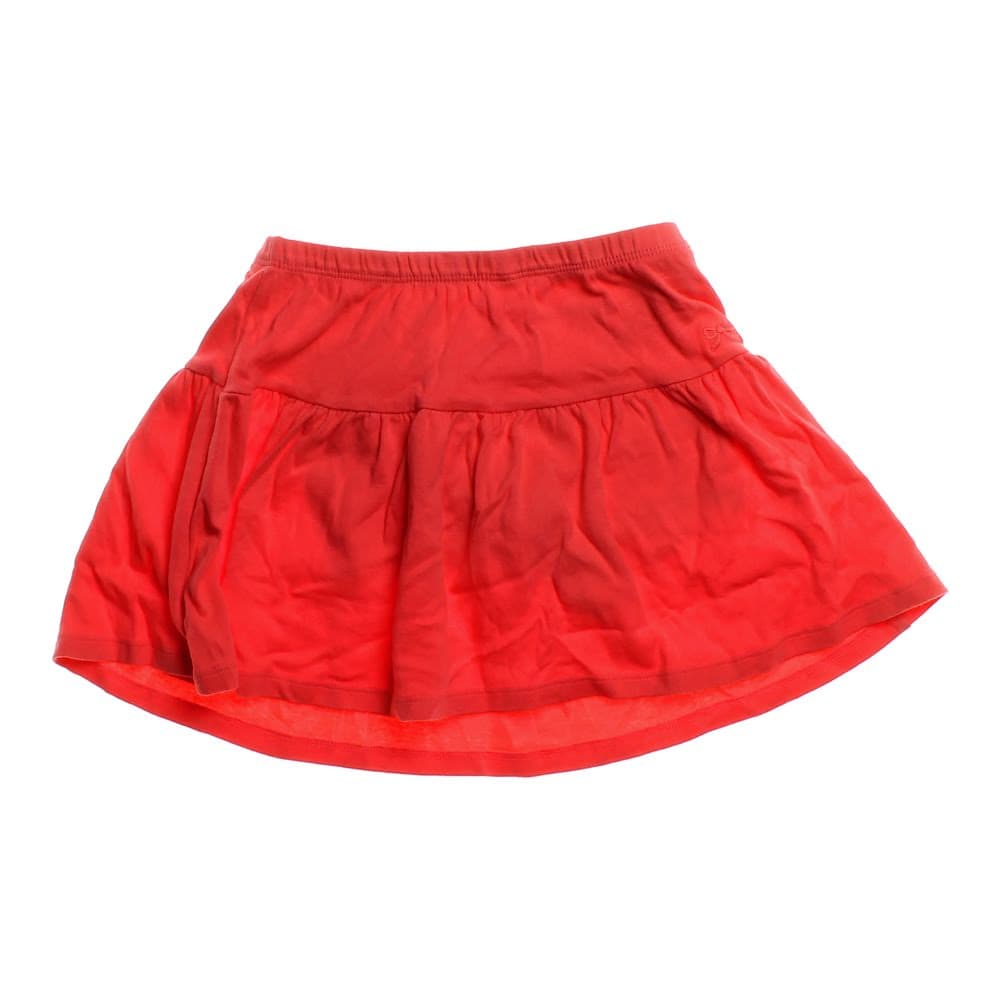 Bright red, lightweight skirt with a flared design and gathered tiers, featuring an elastic waistband for comfort and a smooth finish.