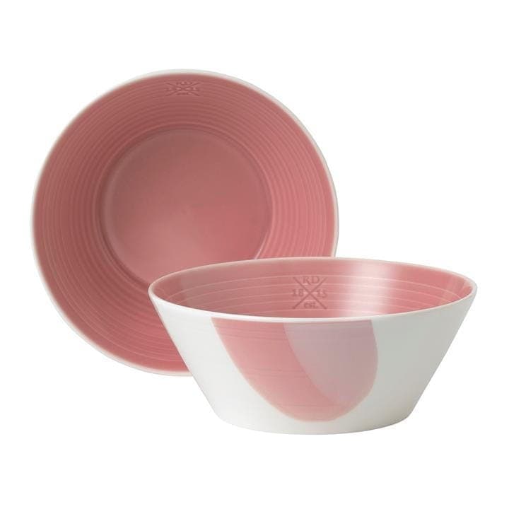 Set of two Royal Doulton Signature 1815 coral cereal bowls featuring a smooth white exterior and a soft coral interior with subtle ribbed detailing.