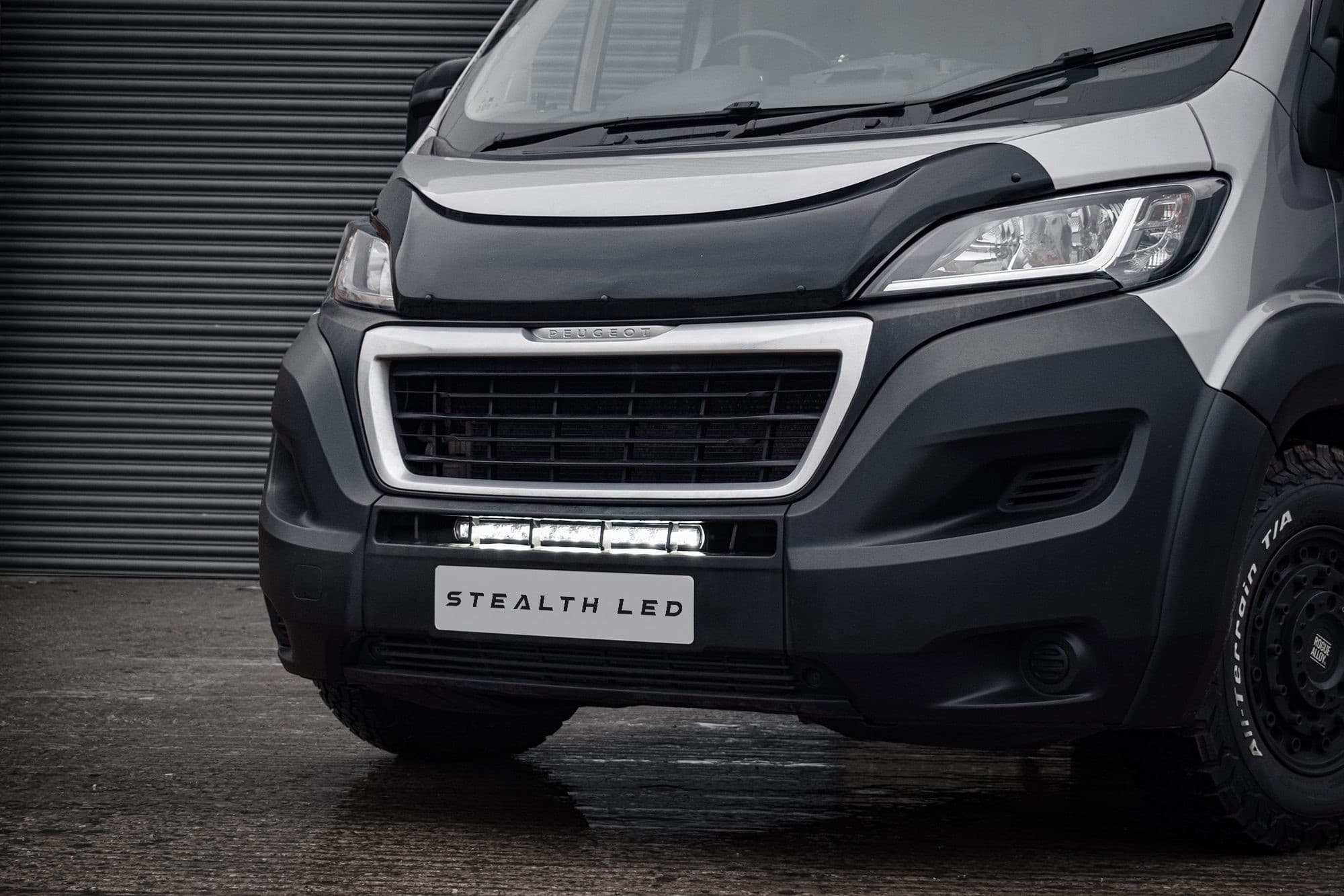 Luminous 20" LED integration kit for Peugeot Boxer (2014-2024) with a sleek black design, featuring bright 8,400 lumens, mounted below the front grille.