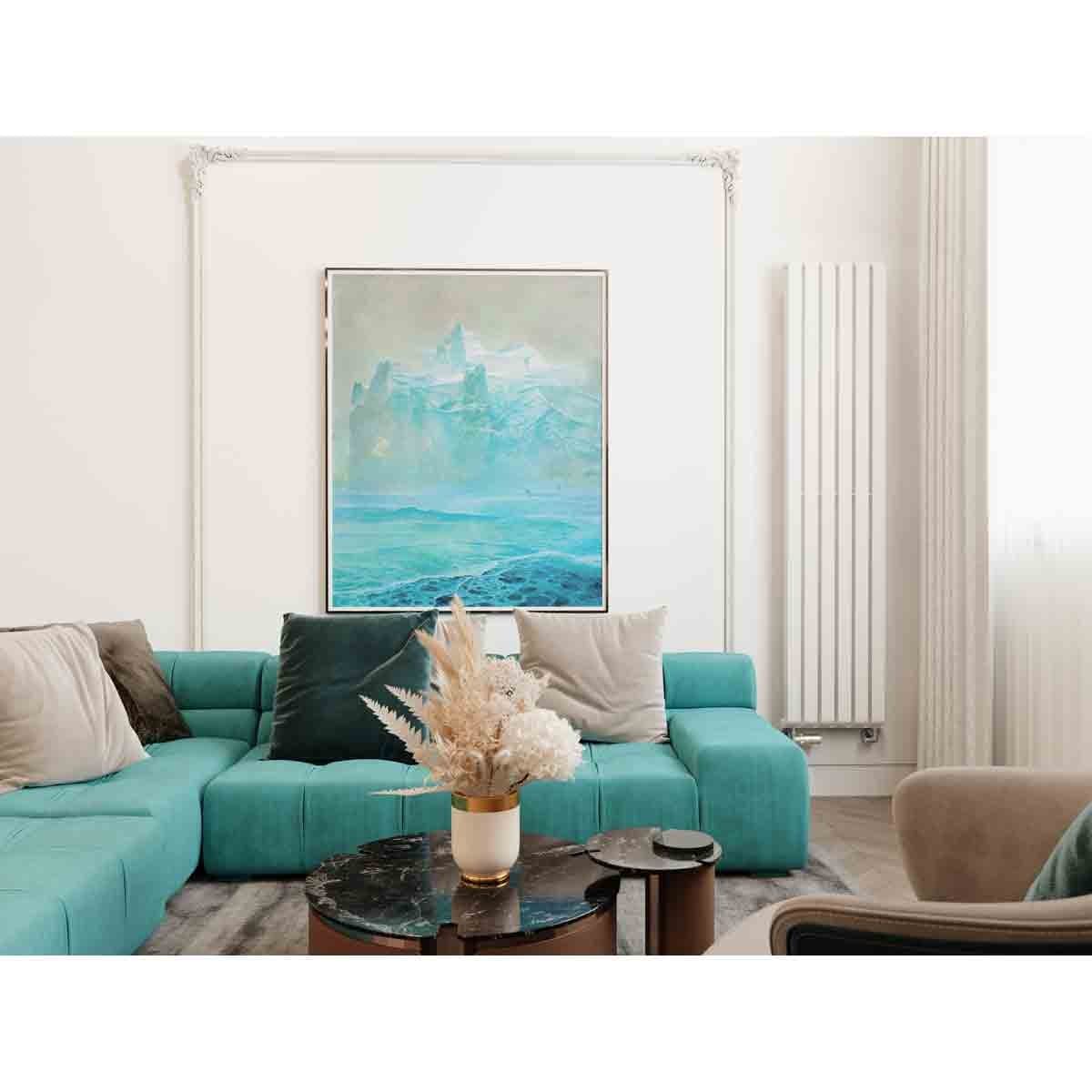 Terma WARP-room radiator in soft matte white (RAL 9016), 1800x395 mm, mounted vertically in a modern living space with teal furniture and a decorative painting.