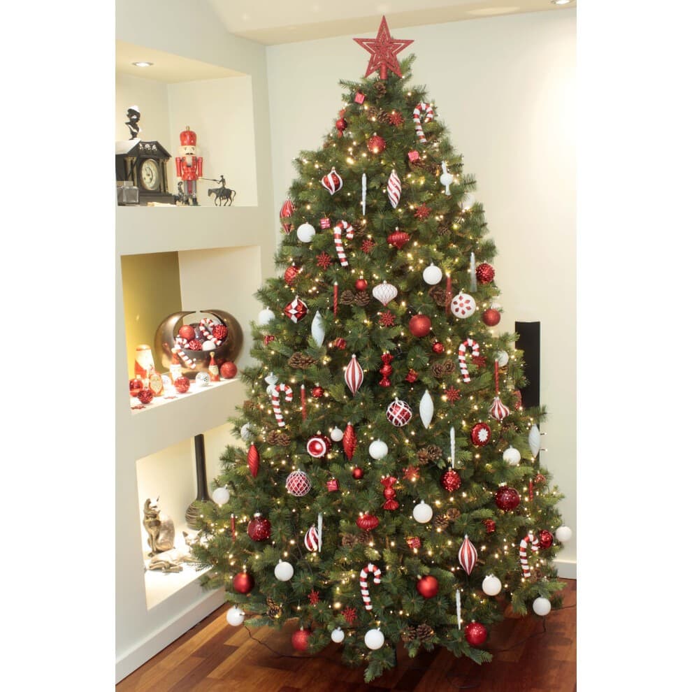 A beautifully decorated 6ft Christmas tree adorned with a variety of red and white baubles, including shiny, matte, and patterned ornaments, topped with a red star.