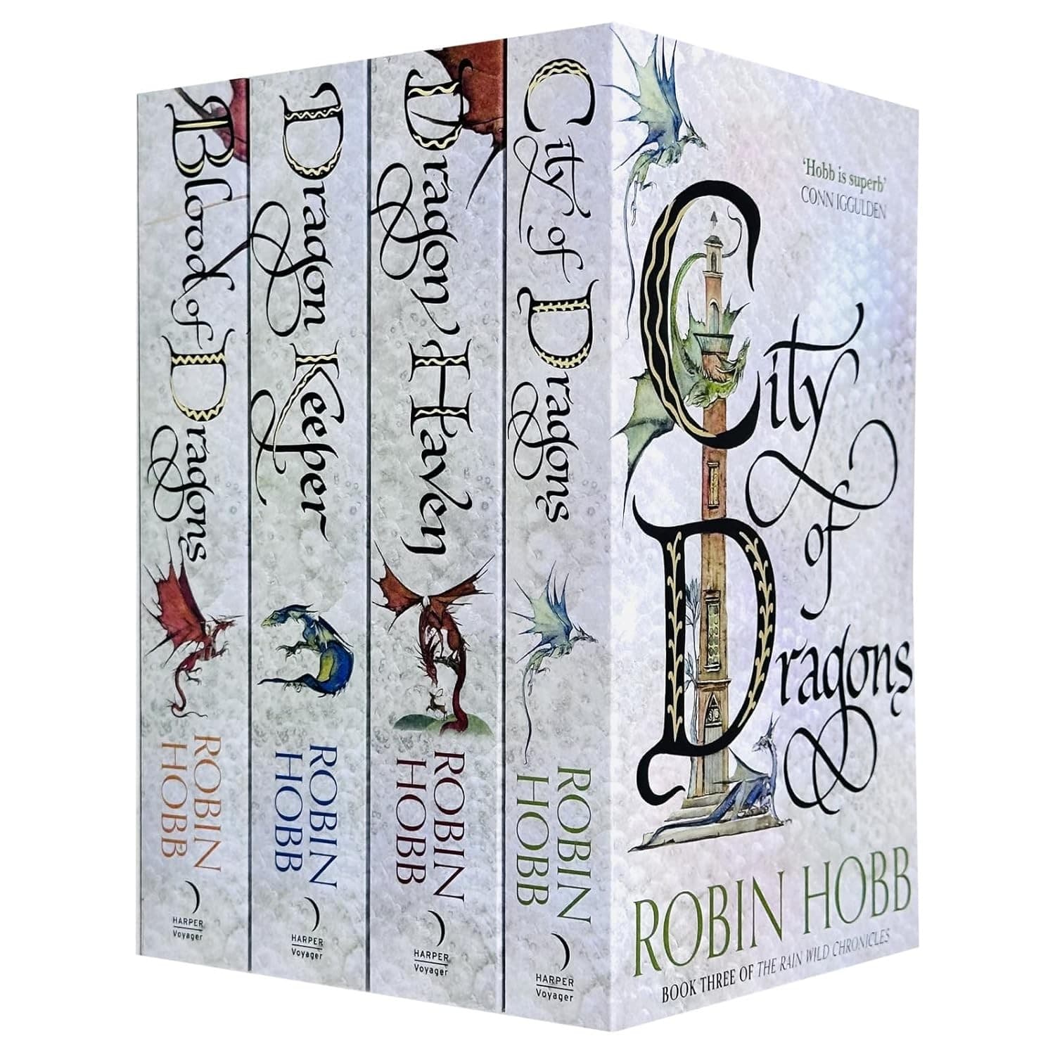 Four-book set of "The Rain Wilds Chronicles" by Robin Hobb, featuring colorful covers with dragon illustrations and elegant typography, presented in a sturdy box.