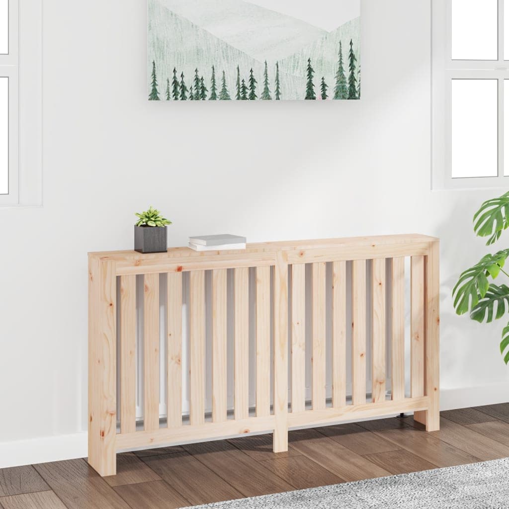 Solid wood pine radiator cover in natural finish, measuring 60.2"x7.5"x33.1", featuring vertical slats and a minimalist design, placed against a light wall with greenery and artwork.