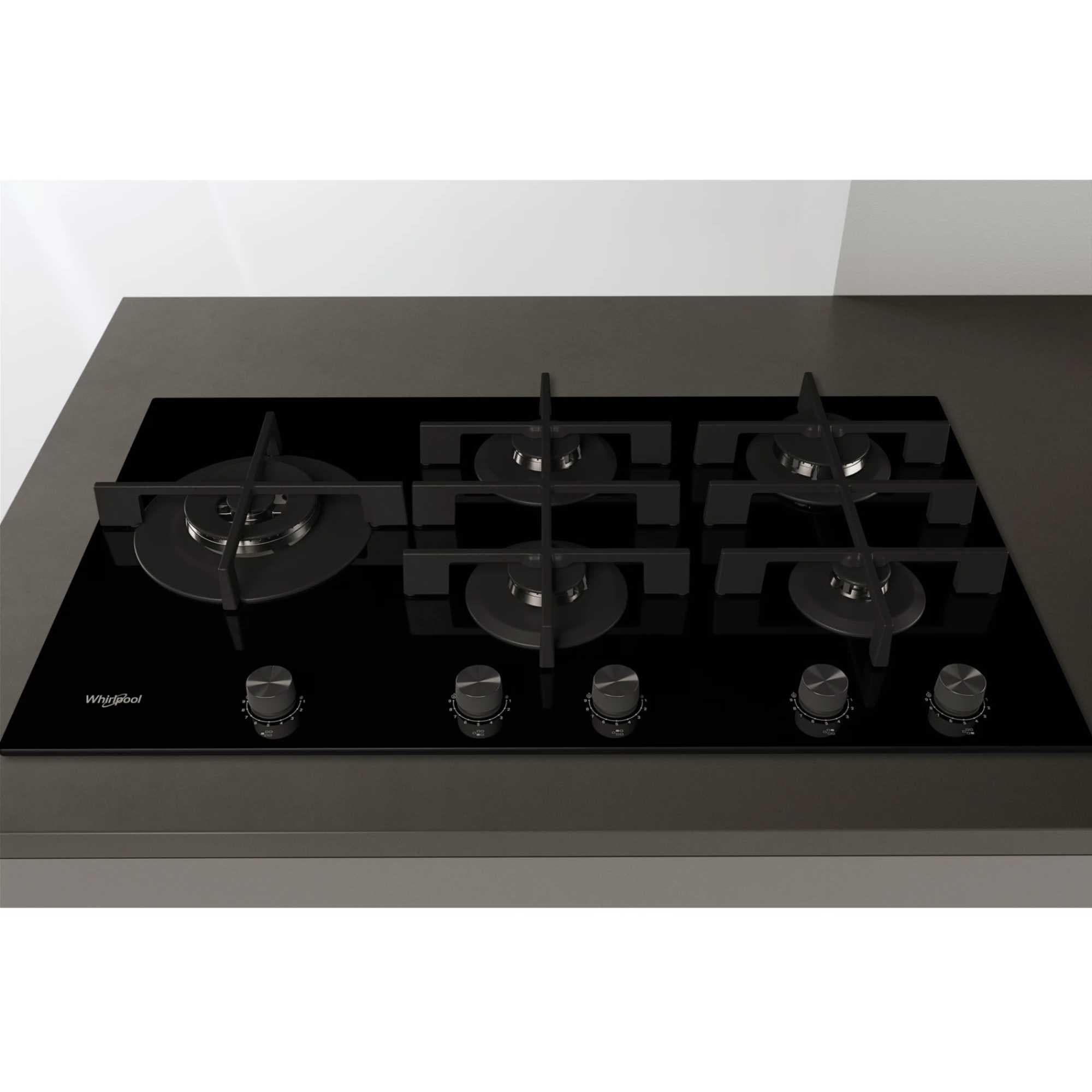 Whirlpool 90cm black glass gas hob featuring five burners, including a powerful 5kW wok burner, with stainless steel knobs and a sleek, modern design.