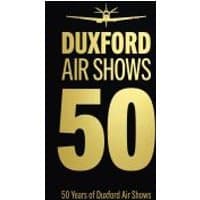 "Black book cover with gold text 'Duxford Air Shows 50' and an airplane silhouette above the title."