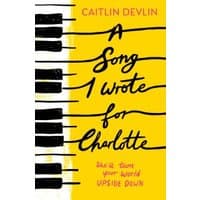 Yellow book cover "A Song I Wrote for Charlotte" with piano keys and handwritten black text.