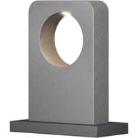 Gray cement LED outdoor pedestal light with circular cutout, rectangular base, and warm 3000K glow by Maytoni Lighting.