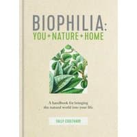 "Biophilia book with beige cover, green leaf illustration, and subtitle 'You + Nature + Home' by Sally Coulthard"
