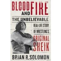 "Book titled 'Blood and Fire' with wrestler image, bold red and black text, by Brian R. Solomon"