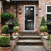 Black composite door with six square panels, two glass inserts, right-hand handle, and 150 cill, set in brick wall.