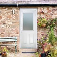 White composite door with two large square glass panels, right-hand handle, and 150 cill, set in a stone wall.