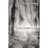 "Ghost Stories book with black and white cover depicting a foggy forest path lined with bare trees."